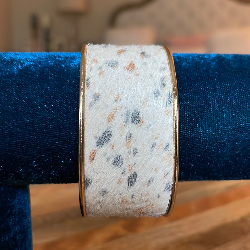 Faux calf half cuff with gold interior.